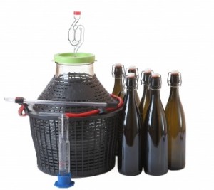 mead demijohn with bottles of mead and bottling cane